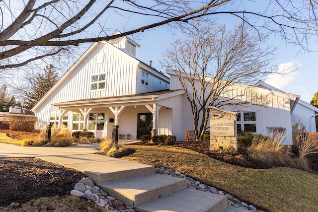view of front of house with covered porch and board and batten siding