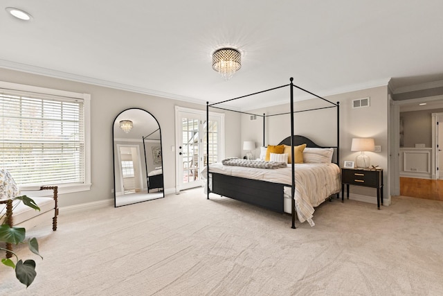 bedroom featuring visible vents, ornamental molding, and light carpet
