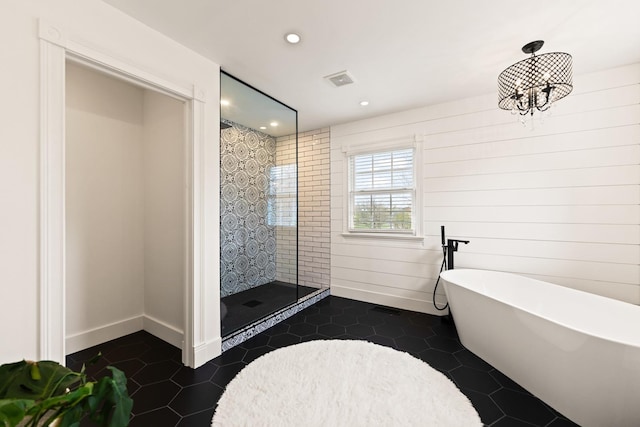 full bath with tile patterned floors, recessed lighting, a freestanding tub, visible vents, and a stall shower