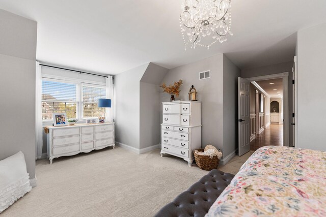 bedroom featuring light colored carpet, arched walkways, a chandelier, baseboards, and visible vents