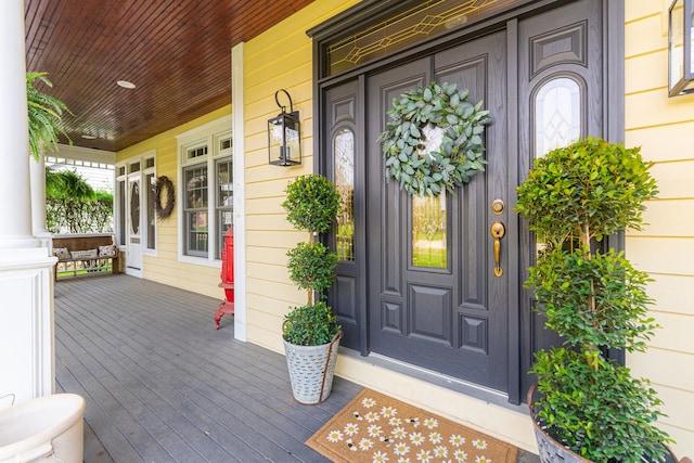 doorway to property featuring covered porch