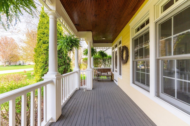 wooden terrace with a porch