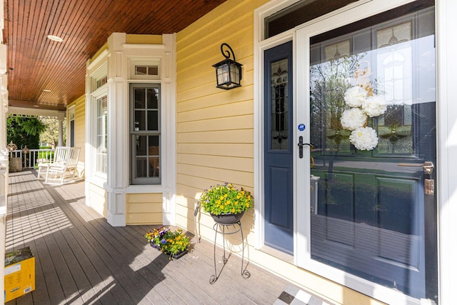 doorway to property with a porch