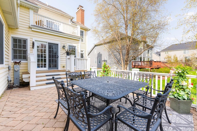 view of patio / terrace featuring entry steps and outdoor dining area