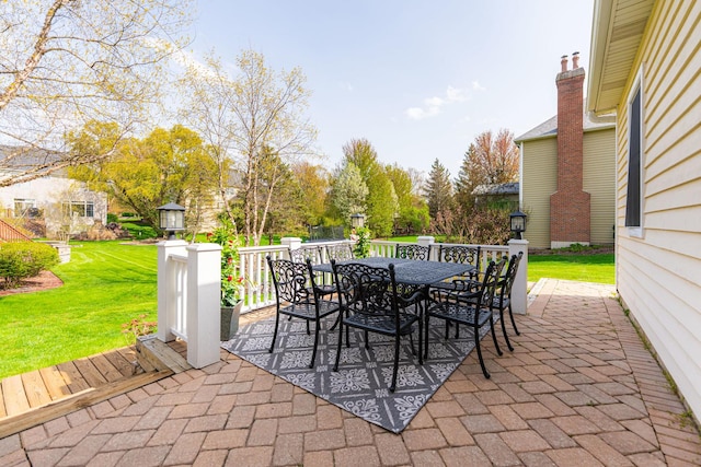 view of patio featuring outdoor dining area