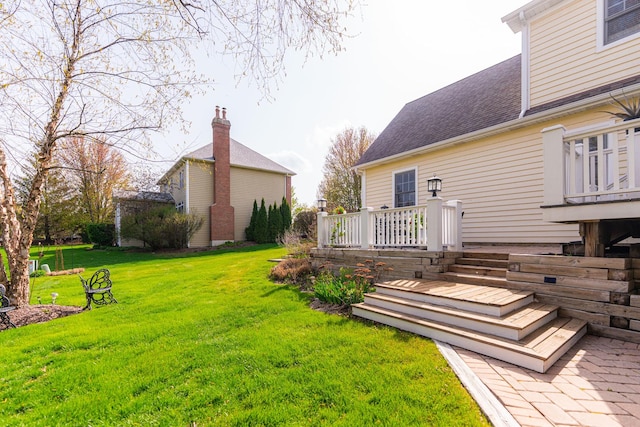 view of yard featuring a wooden deck