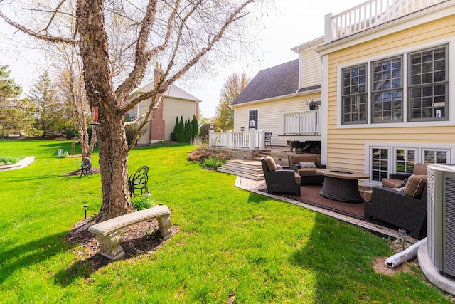view of yard featuring a deck, an outdoor living space, and cooling unit