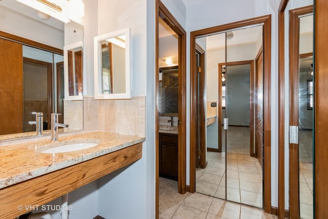 bathroom with vanity and tile patterned flooring