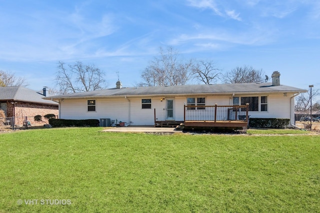 view of front facade featuring a wooden deck, central AC, a front lawn, and fence