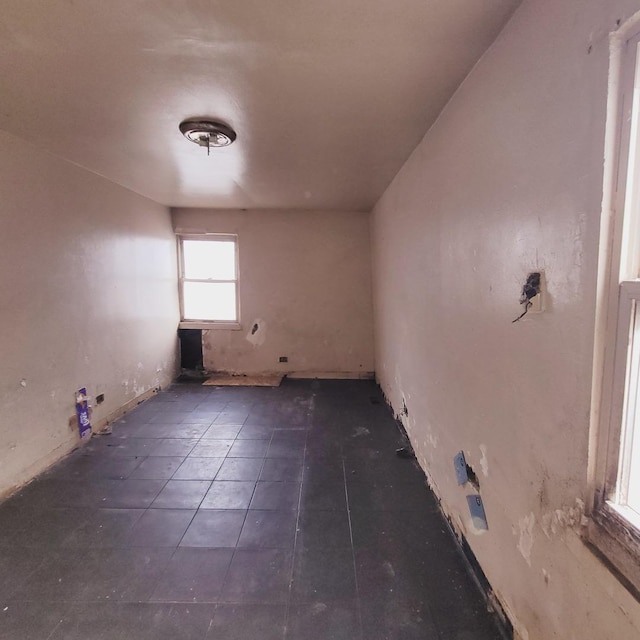 spare room with tile patterned floors