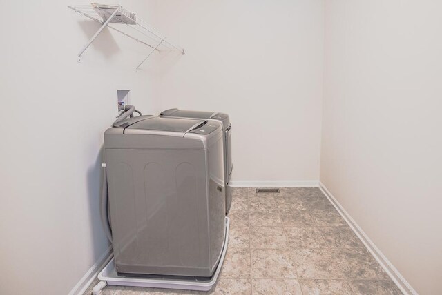 3718 Tramore Ct, Naperville, IL 60564 - washroom featuring laundry area, visible vents, baseboards, and washing machine and clothes dryer