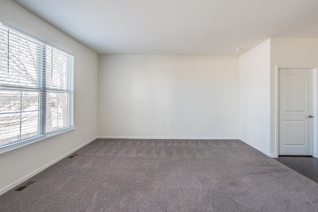 3718 Tramore Ct, Naperville, IL 60564 - unfurnished room with baseboards, visible vents, and dark colored carpet