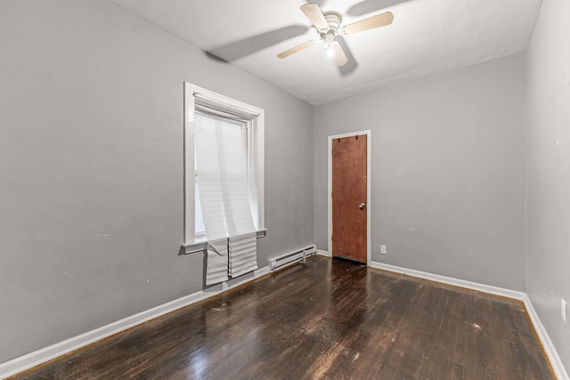 empty room featuring ceiling fan, baseboards, baseboard heating, and wood finished floors