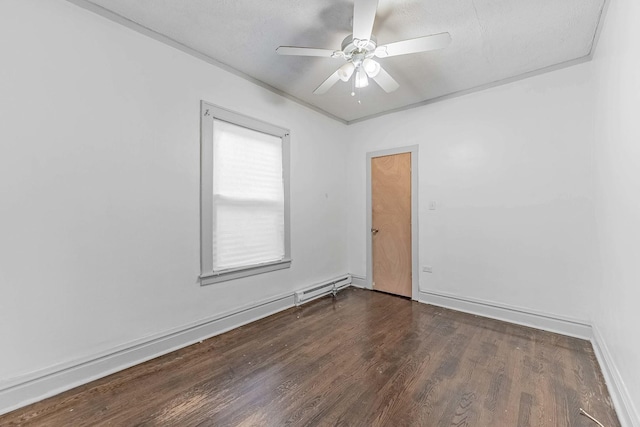 spare room with a ceiling fan, baseboards, baseboard heating, and wood finished floors