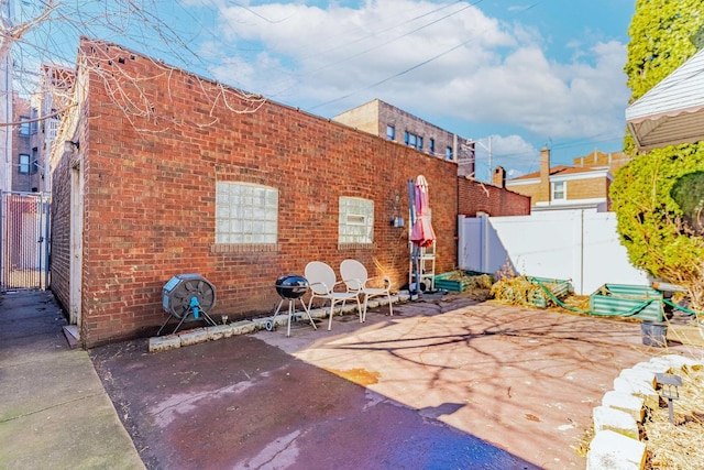 view of patio featuring fence