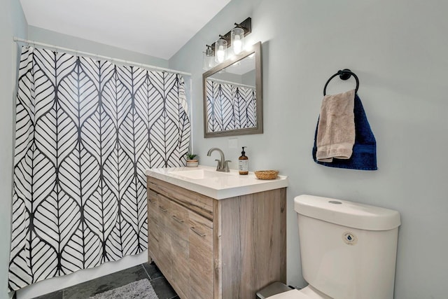 bathroom with vanity, toilet, and a shower with curtain