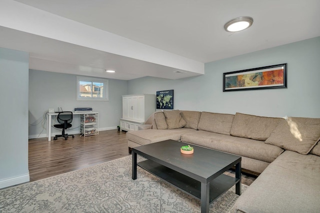 living room featuring wood finished floors and baseboards