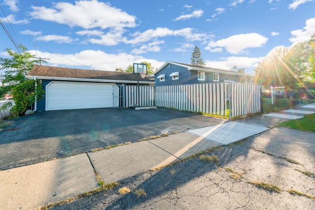 view of front facade with a fenced front yard and an outdoor structure