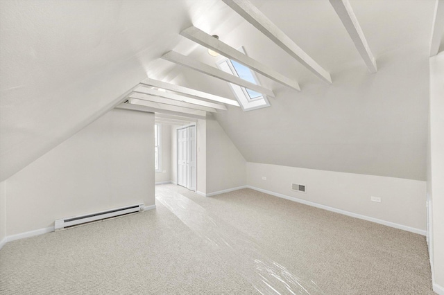 bonus room featuring baseboards, visible vents, carpet floors, vaulted ceiling with skylight, and baseboard heating