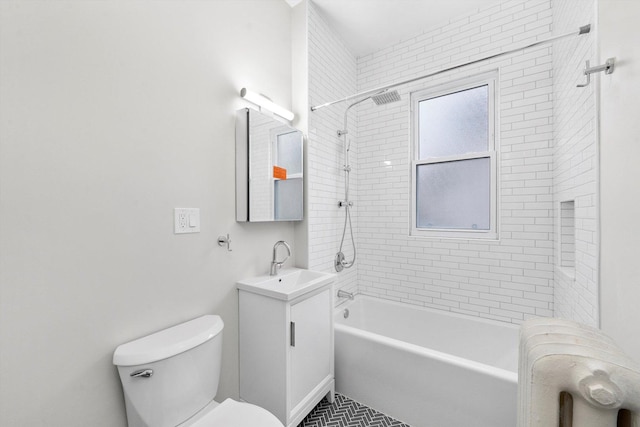 bathroom featuring toilet, shower / washtub combination, and vanity