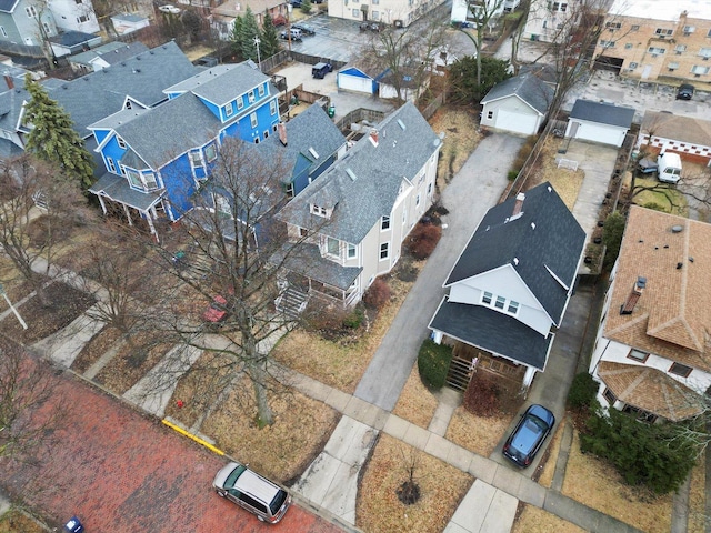 birds eye view of property with a residential view