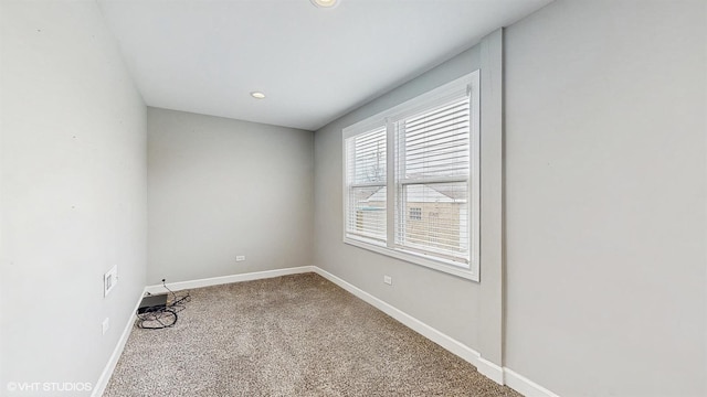 empty room with recessed lighting, baseboards, and carpet