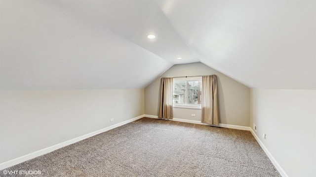 additional living space featuring recessed lighting, baseboards, lofted ceiling, and carpet floors