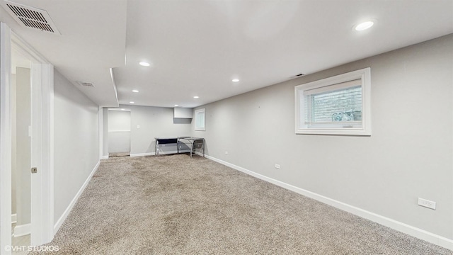 basement with recessed lighting, visible vents, carpet flooring, and baseboards