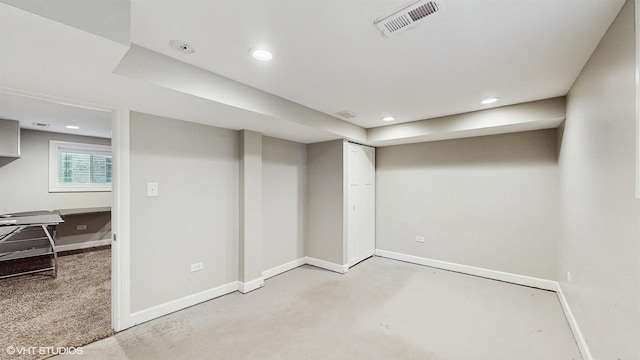 below grade area featuring recessed lighting, visible vents, and baseboards