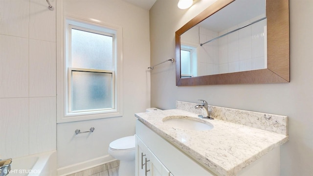 bathroom with tub / shower combination, toilet, and vanity