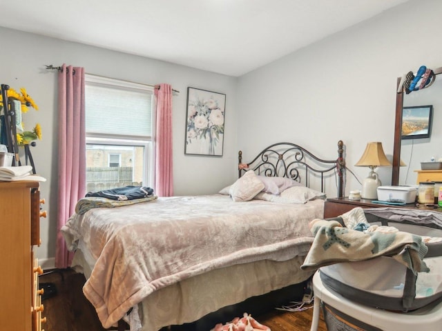 bedroom with wood finished floors