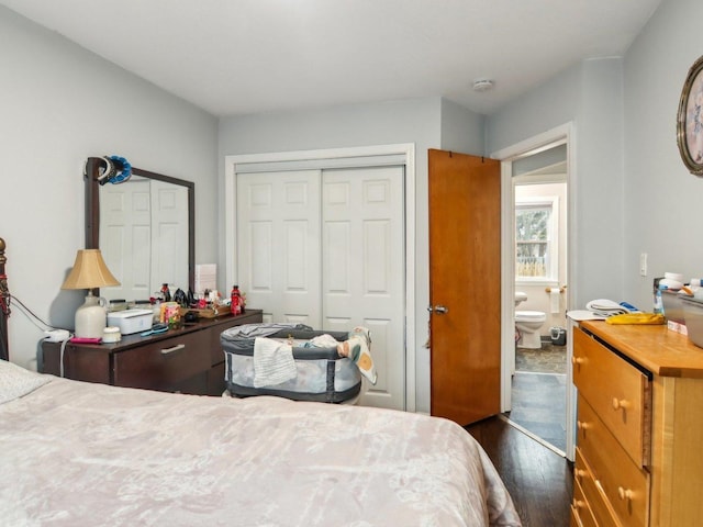 bedroom featuring a closet and dark wood finished floors