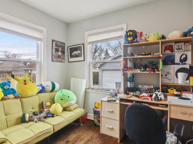 office space with dark wood-type flooring and baseboards