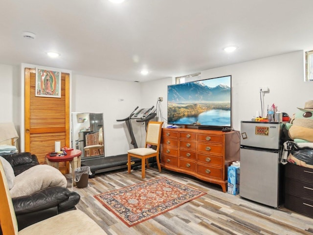 interior space featuring wood finished floors and recessed lighting