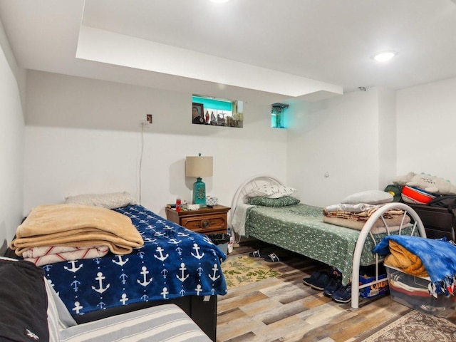 bedroom with wood finished floors