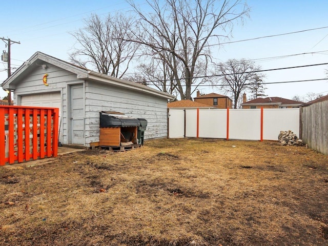 view of yard with a fenced backyard and an outdoor structure