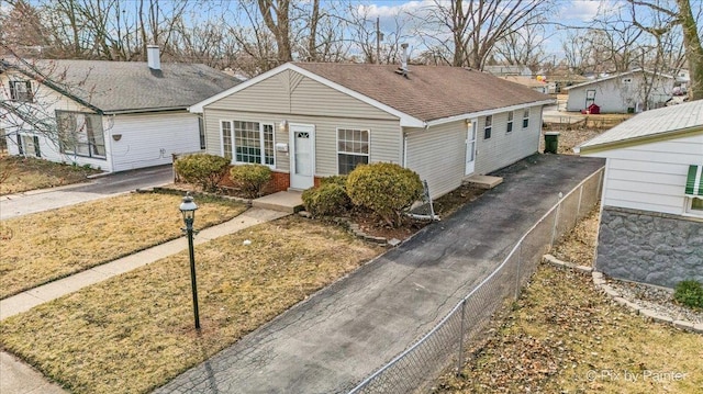 single story home featuring brick siding and a shingled roof