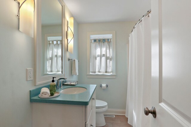 carpeted bedroom featuring ceiling fan and baseboards