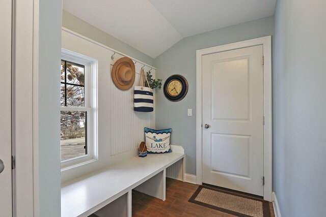 mudroom with lofted ceiling, baseboards, and dark wood-type flooring