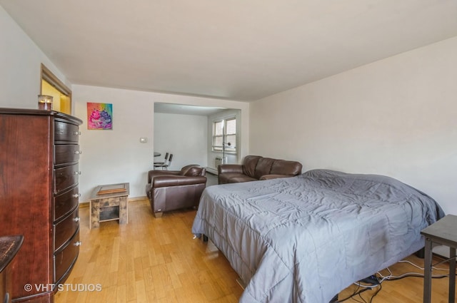 bedroom featuring light wood-style flooring