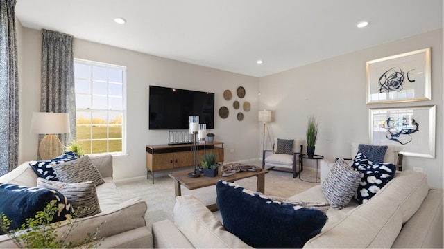 living room featuring carpet, baseboards, and recessed lighting