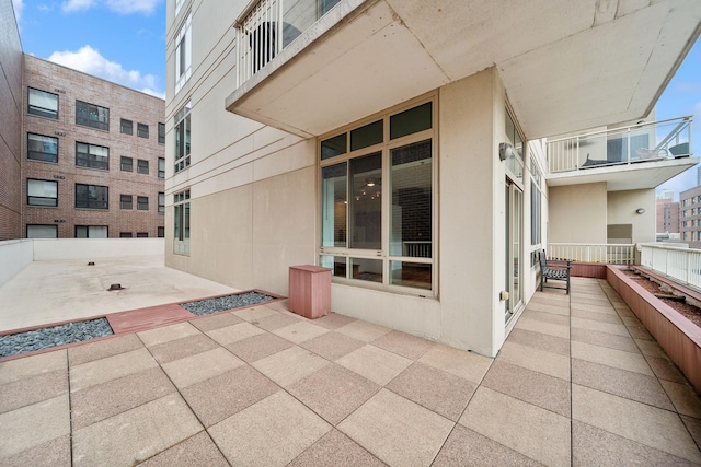 view of patio / terrace with a balcony