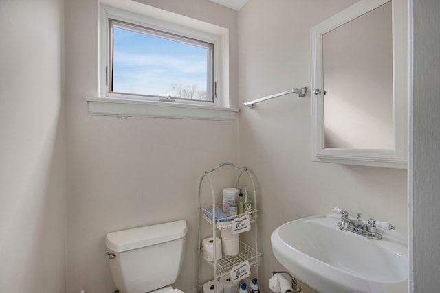 bathroom featuring toilet and a sink