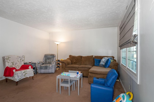 carpeted living room with a textured ceiling and baseboards