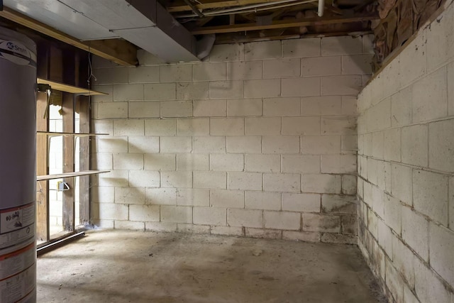 unfinished below grade area with concrete block wall and water heater