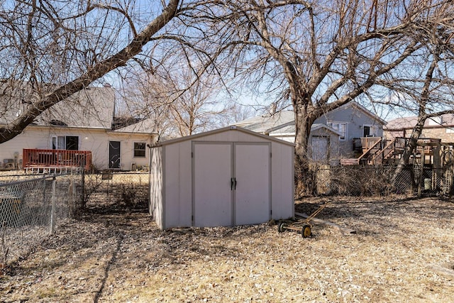 view of shed with fence