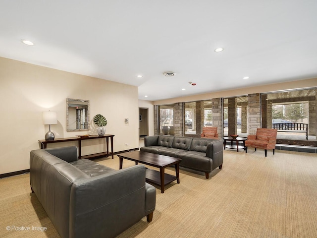 living room featuring baseboards, light colored carpet, and recessed lighting