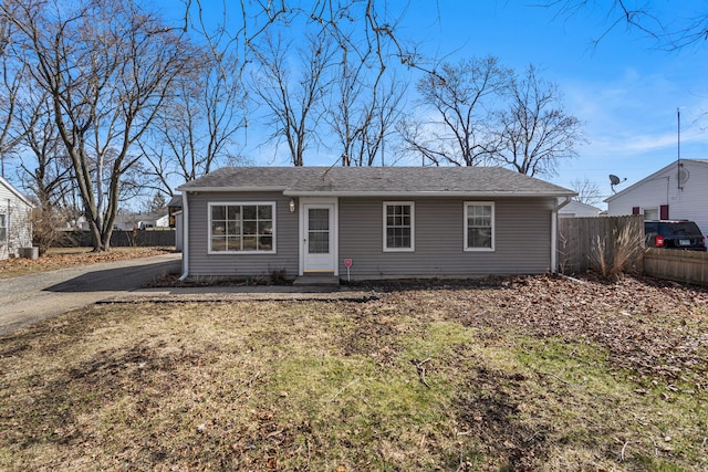 view of front of home featuring fence