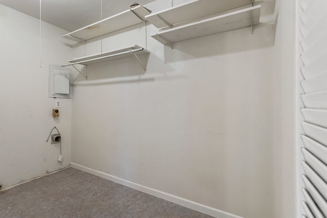 walk in closet featuring attic access