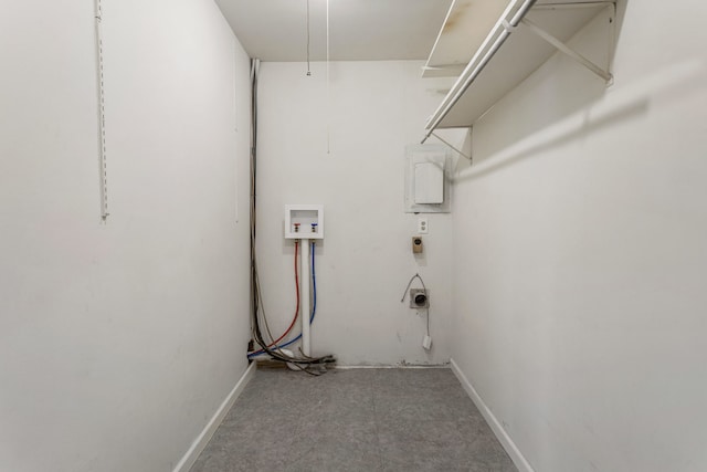 laundry area featuring laundry area, hookup for a washing machine, and baseboards